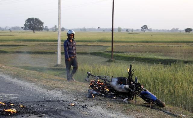 A Madhesi protester looks at a burning motorcycle during a clash between police and protestors at Rajbiraj in Saptari district, 240 km southeast of Kathmandu, on March 6, 2017. (AFP) A Madhesi protester looks at a burning motorcycle during a clash between police and protestors at Rajbiraj in Saptari district, 240 km southeast of Kathmandu, on March 6, 2017. (AFP)
