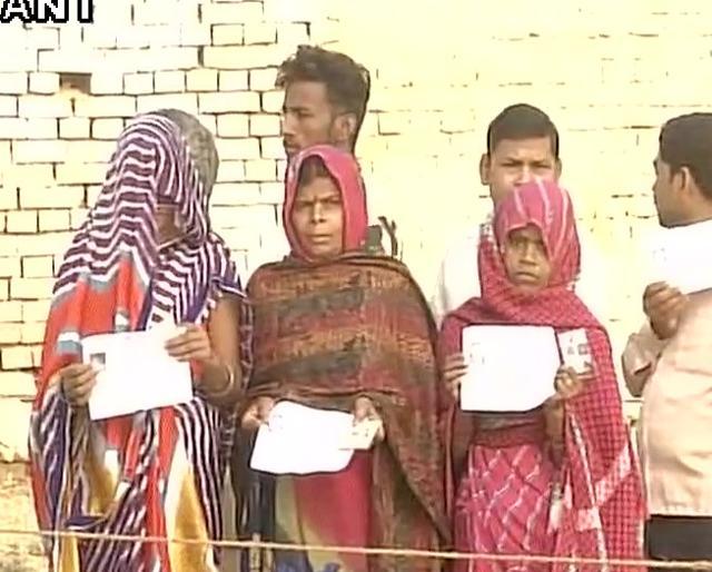 Voters queue up in front of a polling booth in Mirzapur in Uttar Pradesh. (ANI) Voters queue up in front of a polling booth in Mirzapur in Uttar Pradesh. (ANI)