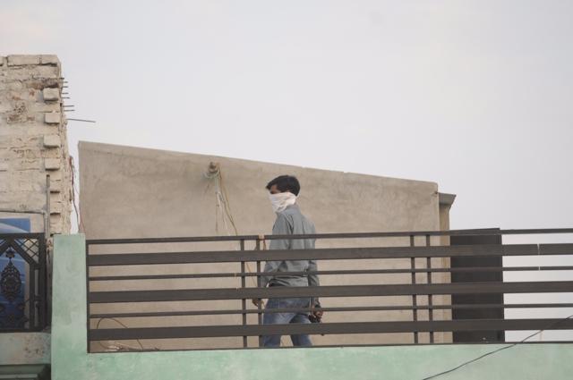 After a nine-hour sporadic gunfight, police said the suspect was wounded but still holed up in the house. (Deepak Gupta/HT Photo) After a nine-hour sporadic gunfight, police said the suspect was wounded but still holed up in the house. (Deepak Gupta/HT Photo)