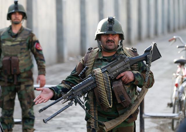 Afghan security forces stand guard outside the military hospital in Kabul that was stormed by Islamic State fighters on March 8, 2017. (Reuters) Afghan security forces stand guard outside the military hospital in Kabul that was stormed by Islamic State fighters on March 8, 2017. (Reuters)
