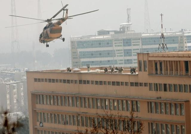 Afghan National Army (ANA) soldiers descend from helicopter on a roof of a military hospital during gunfire and blast in Kabul, Afghanistan March 8, 2017. (Reuters) Afghan National Army (ANA) soldiers descend from helicopter on a roof of a military hospital during gunfire and blast in Kabul, Afghanistan March 8, 2017. (Reuters)