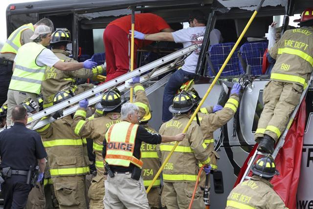 Rescue personnel work to remove passengers from a charter bus that was hit by a CSX train at the Main Street crossing in Biloxi, Miss., on Tuesday, March 7, 2017. (AP) Rescue personnel work to remove passengers from a charter bus that was hit by a CSX train at the Main Street crossing in Biloxi, Miss., on Tuesday, March 7, 2017. (AP)