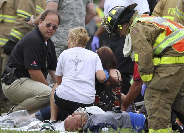 Rescue personnel treat passengers from a charter bus that was hit by a CSX train at the Main Street crossing in Biloxi, Miss., on Tuesday, March 7, 2017. (AP) Rescue personnel treat passengers from a charter bus that was hit by a CSX train at the Main Street crossing in Biloxi, Miss., on Tuesday, March 7, 2017. (AP)