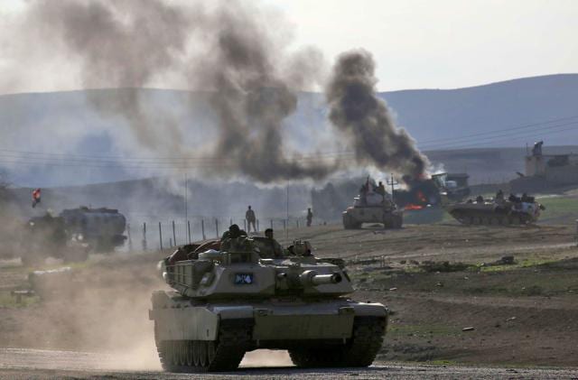 Iraqi government forces supported by fighters from the Abbas Brigade — which fights under the umbrella of the Shia popular mobilisation units — around 15 km northwest of Mosul. (AFP) Iraqi government forces supported by fighters from the Abbas Brigade — which fights under the umbrella of the Shia popular mobilisation units — around 15 km northwest of Mosul. (AFP)