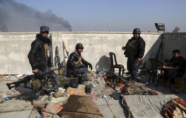 Soldiers take combat positions as Iraqi security forces advance during fighting against Islamic State militants in western Mosul. (AP) Soldiers take combat positions as Iraqi security forces advance during fighting against Islamic State militants in western Mosul. (AP)