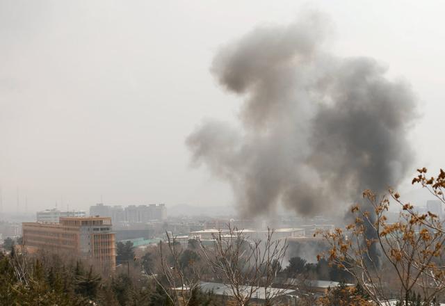 Smoke rises from the military hospital in Kabul that was attacked by Islamic State fighters on March 8, 2017. (Reuters) Smoke rises from the military hospital in Kabul that was attacked by Islamic State fighters on March 8, 2017. (Reuters)