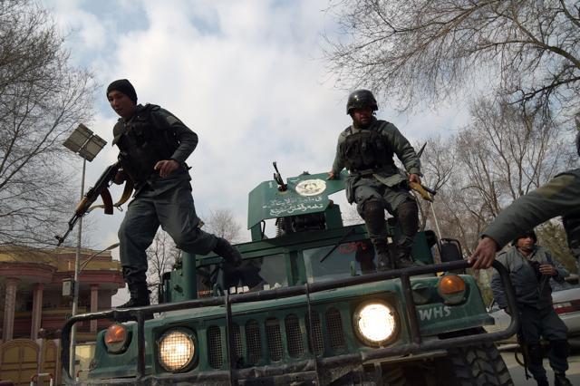 Afghan policemen leap from a vehicle as they arrive at Afghanistan's largest military hospital, which was attacked by Islamic State fighters on March 8, 2017. (AFP) Afghan policemen leap from a vehicle as they arrive at Afghanistan's largest military hospital, which was attacked by Islamic State fighters on March 8, 2017. (AFP)