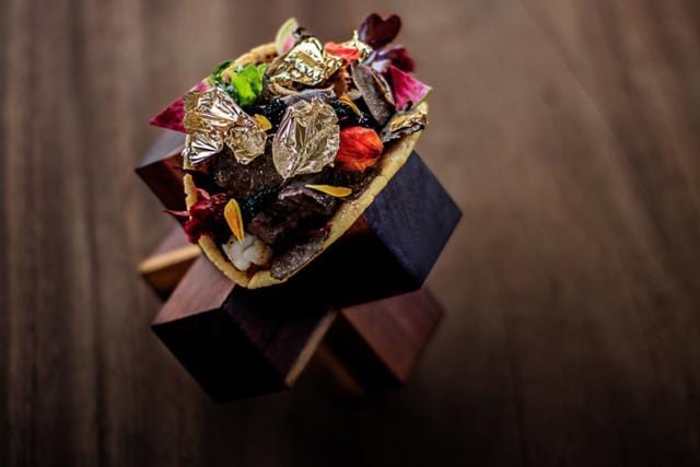 A corn tortilla filled it with beef, shrimp, caviar and black truffle Brie cheese, and speckled with 24 carat gold flakes. (loscabosmexicoblog.com)