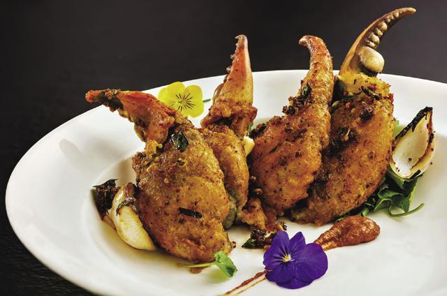At Avartana restaurant, crab claws are fried in tempura batter and placed on a bed of red chilli chutney. At Avartana restaurant, crab claws are fried in tempura batter and placed on a bed of red chilli chutney.