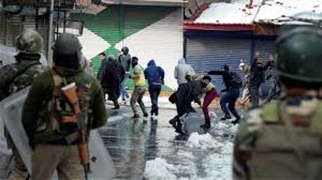Youths pelting stones in Kashmir. (PTI Photo) Youths pelting stones in Kashmir. (PTI Photo)