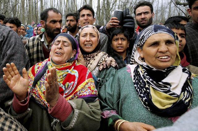 Wailing relatives of 15-year old Amir Nazir, the civilian killed in the encounter between security forces and Lashkar-e-Toiba (LeT) militants, during his funeral at Begumbagh in Pulwama district of south Kashmir on Thursday. (PTI)