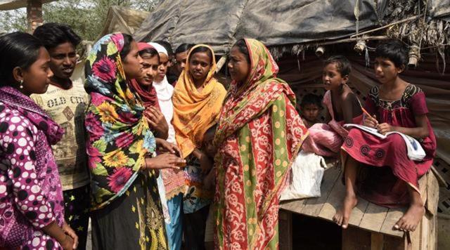 Children speaking with Anoyara’s mother near her home in Choto Asgara village, Sandeshkhali. (Samir Jana/HT Photo) Children speaking with Anoyara’s mother near her home in Choto Asgara village, Sandeshkhali. (Samir Jana/HT Photo)