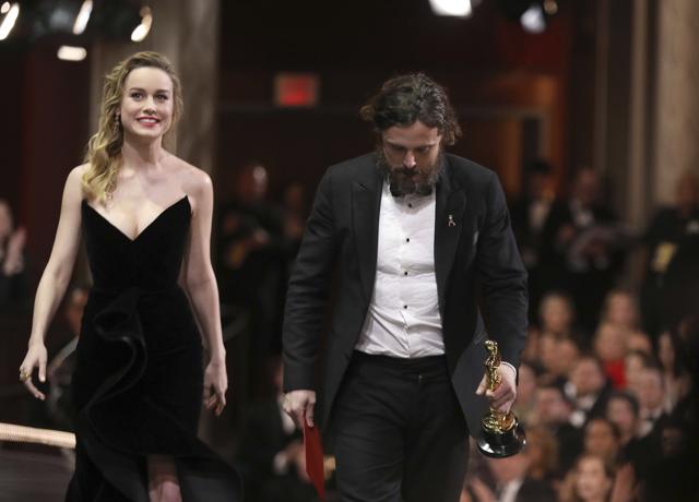 Brie Larson, left, and Casey Affleck, winner of the award for best actor in a leading role for Manchester by the Sea, exit the stage at the Oscars on Sunday. (Matt Sayles/Invision/AP)