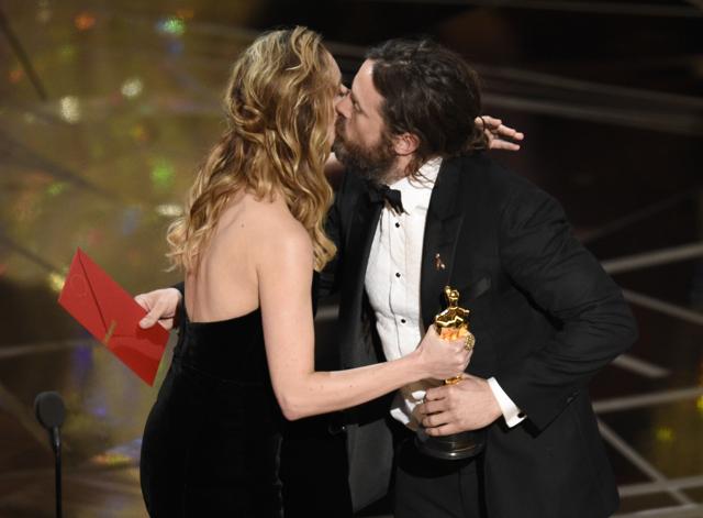 Brie Larson, left, congratulates Casey Affleck as he accepts the award for best actor in a leading role for Manchester by the Sea at the Oscars. (Chris Pizzello/Invision/AP)