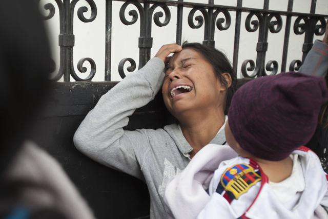 A relative of a youth who resided at the Virgin of the Assumption Safe Home wails as she waits for the release of the names of those who died in the fire. (AP) A relative of a youth who resided at the Virgin of the Assumption Safe Home wails as she waits for the release of the names of those who died in the fire. (AP)
