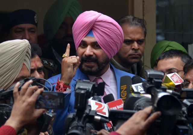 Cricketer-turned-politician and former member of parliament and current Congress Party candidate for Punjab assembly Navjot Singh Sidhu (C) gestures as he addresses media representatives after filing his nomination papers to the District Development Panchayat Officer in Amritsar. (AFP Photo) Cricketer-turned-politician and former member of parliament and current Congress Party candidate for Punjab assembly Navjot Singh Sidhu (C) gestures as he addresses media representatives after filing his nomination papers to the District Development Panchayat Officer in Amritsar. (AFP Photo)