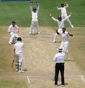 India players celebrate the wicket of Australia's David Warner in the Bangalore Test. (REUTERS) India players celebrate the wicket of Australia's David Warner in the Bangalore Test. (REUTERS)