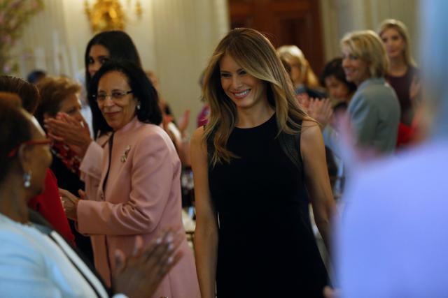 US first lady Melania Trump greets guests for an International Women's Day luncheon in the State Dining Room at the White House in Washington. (REUTERS) US first lady Melania Trump greets guests for an International Women's Day luncheon in the State Dining Room at the White House in Washington. (REUTERS)