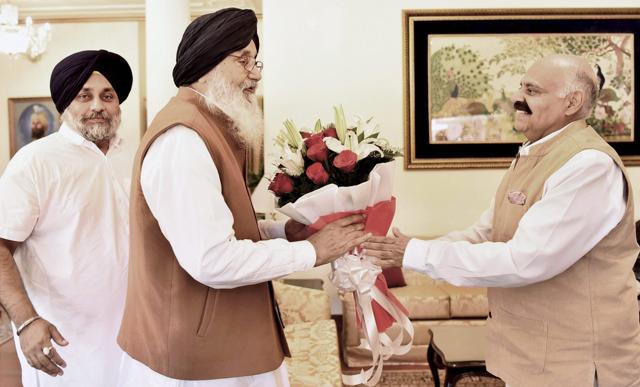 Akali Dal veteran Parkash Singh Badal, along with Sukhbir Singh Badal, during a meeting with Punjab Governor VP Singh Badnore to hand over his resignation letter after losing the Punjab Assembly election. (PTI)