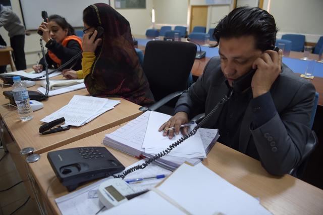 Employees of the Pakistan Bureau of Statistics and headquarters of the population census 2017, speak on public helplines to give information about the census in Islamabad on Monday. (AFP) Employees of the Pakistan Bureau of Statistics and headquarters of the population census 2017, speak on public helplines to give information about the census in Islamabad on Monday. (AFP)