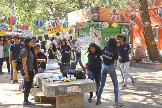 A girl gets splashed with a water balloon at Confluence’17. (Raajesh Kashyap/HT Photo)