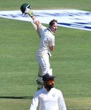 Australias captain Steve Smith celebrates after scoring a century as Indias captain Virat Kohli looks on the third day of the first cricket Test match between India and Australia in Pune. (AFP) Australias captain Steve Smith celebrates after scoring a century as Indias captain Virat Kohli looks on the third day of the first cricket Test match between India and Australia in Pune. (AFP)
