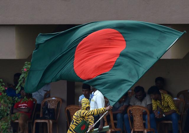 A Bangladeshi cricket supporter, with his face painted in the style of a tiger, waves his national flag during the fourth day of the opening Test match between Sri Lanka and Bangladesh at the Galle International Cricket Stadium in Galle on March 10, 2017. (AFP) A Bangladeshi cricket supporter, with his face painted in the style of a tiger, waves his national flag during the fourth day of the opening Test match between Sri Lanka and Bangladesh at the Galle International Cricket Stadium in Galle on March 10, 2017. (AFP)