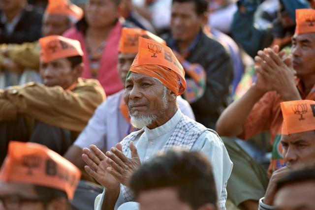 A man listens during a BJP election rally at Wangkhem village in Thoubal district, Manipur. (AFP Photo)