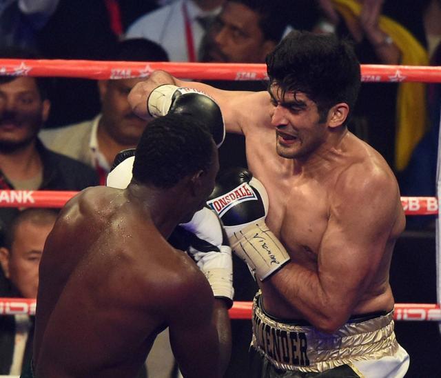 New Delhi: Indian boxing star Vijender Singh fights with Francis Cheka of Tanzania. (PTI) New Delhi: Indian boxing star Vijender Singh fights with Francis Cheka of Tanzania. (PTI)