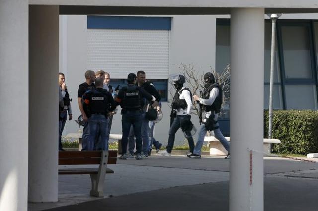 Police inside the Tocqueville high school after a shooting took place in Grasse, southern France. (Reuters)