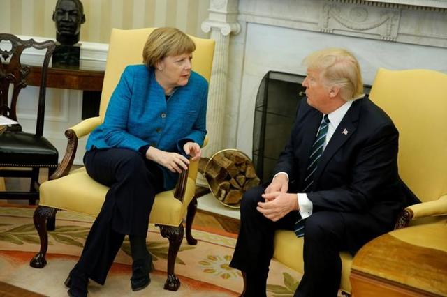 US President Donald Trump and Germany's Chancellor Angela Merkel during their meeting in the Oval Office at the White House in Washington on Friday. (Reuters) US President Donald Trump and Germany's Chancellor Angela Merkel during their meeting in the Oval Office at the White House in Washington on Friday. (Reuters)