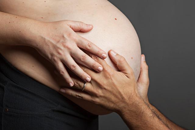 Research suggests an unborn baby can even distinguish between her/his mother and father's touch. (Shutterstock)