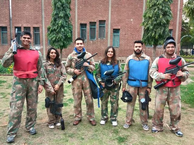 Students pose in their paintball gear before a session.
