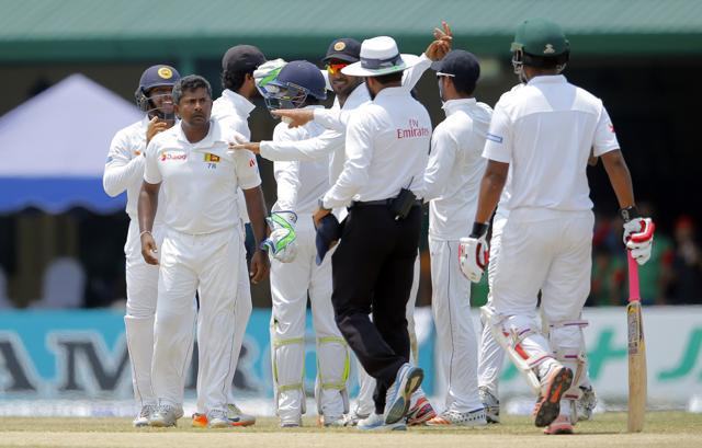 Rangana Herath and Dilruwan Perera took three wickets each as Sri Lanka fought hard. (AP) Rangana Herath and Dilruwan Perera took three wickets each as Sri Lanka fought hard. (AP)