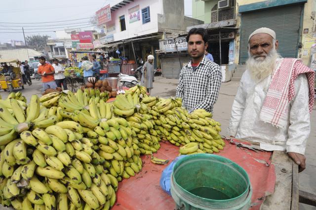 Mohammad Yamin (right), a fruit seller in Jewar, is shocked by the BJP’s choice of chief minister in UP. (Sunil Ghosh/HT Photo) Mohammad Yamin (right), a fruit seller in Jewar, is shocked by the BJP’s choice of chief minister in UP. (Sunil Ghosh/HT Photo)