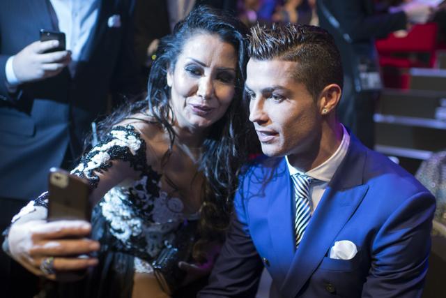 Cristiano Ronaldo of Portugal poses for a selfie with an unidentified woman prior to the start of the The Best FIFA Football Awards 2016 ceremony held at the Swiss TV studio in Zurich on Jan. 9, 2017. (AP) Cristiano Ronaldo of Portugal poses for a selfie with an unidentified woman prior to the start of the The Best FIFA Football Awards 2016 ceremony held at the Swiss TV studio in Zurich on Jan. 9, 2017. (AP)