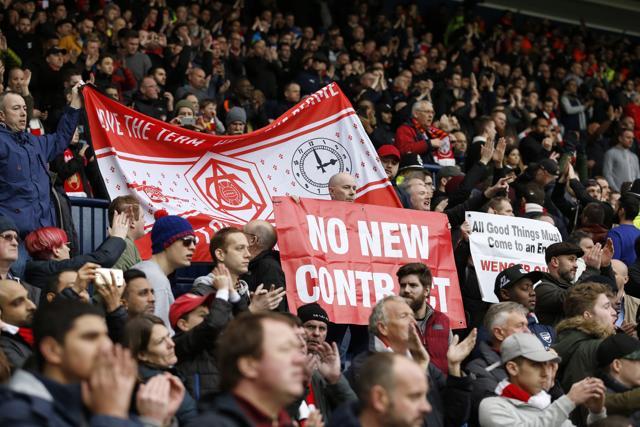 Arsenal fans hold up banners directed at manager Arsene Wenger at the end of the match against West Brom. (REUTERS)