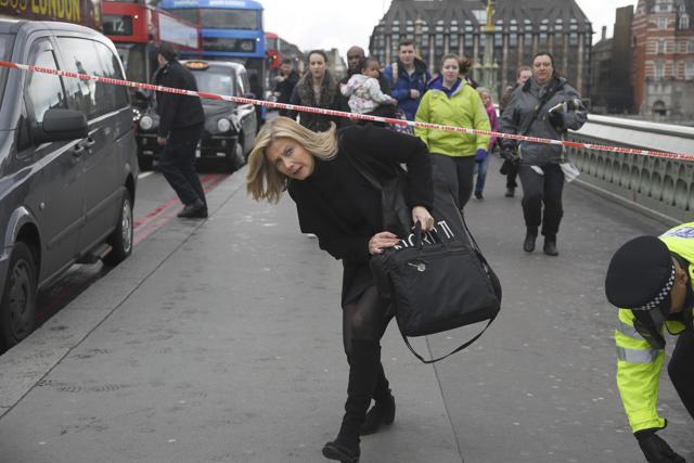 A woman ducks under a police tape after an incident on Westminster Bridge in London, March 22, 2017. (REUTERS Photo) A woman ducks under a police tape after an incident on Westminster Bridge in London, March 22, 2017. (REUTERS Photo)