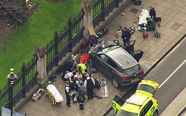 In this image taken from video police officers gather around a car adjacent to Houses of Parliament in London, Wednesday, March 23, 2017 after the House of Commons sitting was suspended as witnesses reported sounds like gunfire outside. (AP Photo) In this image taken from video police officers gather around a car adjacent to Houses of Parliament in London, Wednesday, March 23, 2017 after the House of Commons sitting was suspended as witnesses reported sounds like gunfire outside. (AP Photo)