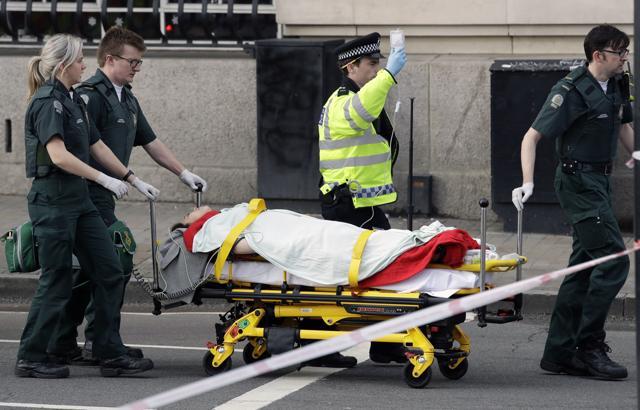 Emergency services transport an injured person to an ambulance, close to the Houses of Parliament in London. (AP Photo) Emergency services transport an injured person to an ambulance, close to the Houses of Parliament in London. (AP Photo)