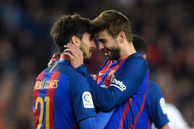 Barcelona's Portuguese midfielder Andre Gomes (L) celebrates with Barcelona's defender Gerard Pique (R) after scoring a goal during the Spanish league football match FC Barcelona vs Valencia CF at the Camp Nou stadium in Barcelona on March 19, 2017. (AFP) Barcelona's Portuguese midfielder Andre Gomes (L) celebrates with Barcelona's defender Gerard Pique (R) after scoring a goal during the Spanish league football match FC Barcelona vs Valencia CF at the Camp Nou stadium in Barcelona on March 19, 2017. (AFP)
