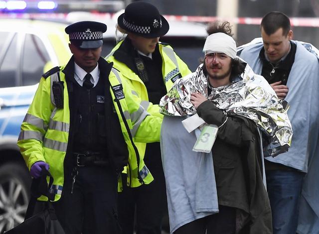 A member of the public is treated by emergency services near Westminster Bridge and the Houses of Parliament on March 22, 2017 in London, England. (Getty Images) A member of the public is treated by emergency services near Westminster Bridge and the Houses of Parliament on March 22, 2017 in London, England. (Getty Images)