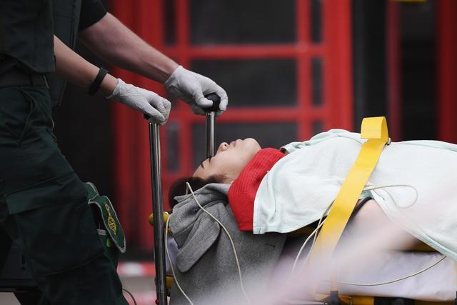 A member of the public is taken away for treatment by emergency services near Westminster Bridge and the Houses of Parliament on March 22, 2017 in London, England. (Getty Images) A member of the public is taken away for treatment by emergency services near Westminster Bridge and the Houses of Parliament on March 22, 2017 in London, England. (Getty Images)