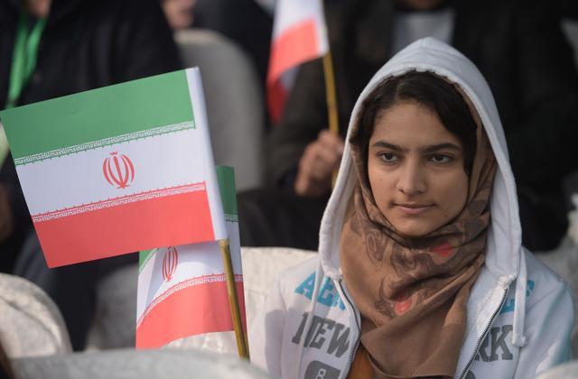 An Iranian fan holds a flag as she watches a Davis Cup match between Pakistan and Iran at the Sports Complex in Islamabad on February 5, 2017. (AFP) An Iranian fan holds a flag as she watches a Davis Cup match between Pakistan and Iran at the Sports Complex in Islamabad on February 5, 2017. (AFP)