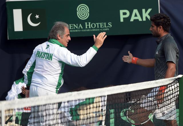 Team coach Rashid Ahmad Malik (L) greets Mohammad Abid of Pakistan after he won points against Shahin Khaledan of Iran during their Davis Cup tennis match at the Sports Complex in Islamabad on February 5, 2017. (AFP) Team coach Rashid Ahmad Malik (L) greets Mohammad Abid of Pakistan after he won points against Shahin Khaledan of Iran during their Davis Cup tennis match at the Sports Complex in Islamabad on February 5, 2017. (AFP)
