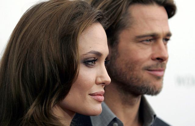 Angelina Jolie and Brad Pitt arrive at the screening of her directorial debut In the Land of Blood and Honey. (REUTERS)