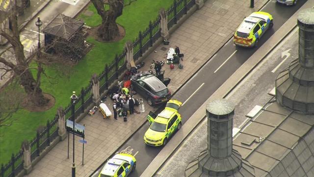 Police officers gather around a car adjacent to Houses of Parliament in London, on March 22, 2017, after it mowed down several pedestrians on Westminster Bridge. The House of Commons sitting was suspended as witnesses reported sounds like gunfire outside. (AP Photo) Police officers gather around a car adjacent to Houses of Parliament in London, on March 22, 2017, after it mowed down several pedestrians on Westminster Bridge. The House of Commons sitting was suspended as witnesses reported sounds like gunfire outside. (AP Photo)