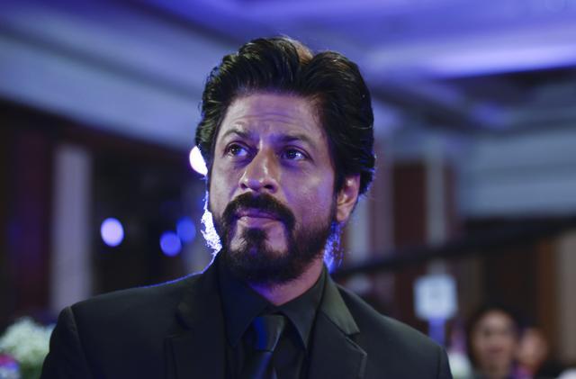 Shah Rukh Khan looked impeccable last year in a black suit and tie. (Satish Bate/ HT Photo)