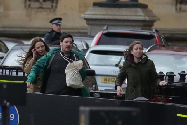 People leave after being evacuated from the Houses of Parliament in central London on March 22, 2017 during an emergency incident. (AFP Photo) People leave after being evacuated from the Houses of Parliament in central London on March 22, 2017 during an emergency incident. (AFP Photo)