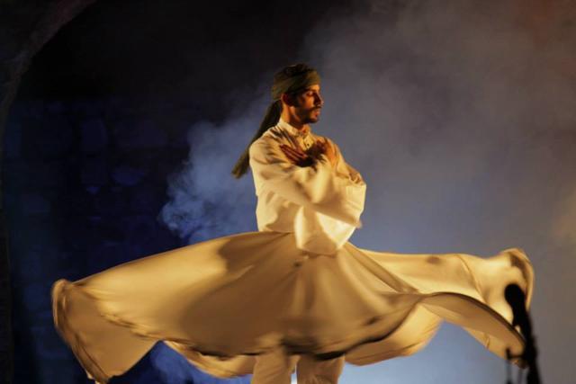 A whirling dervish at Jahan-e-Khusrau in 2015. Inspired by Delhi’s Sufi legacy, the festival celebrates Sufi music from across the world. (Muzaffar Ali)